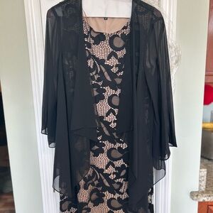 Women's size 10, black & beige, 1 piece Covington dress, in like new condition.